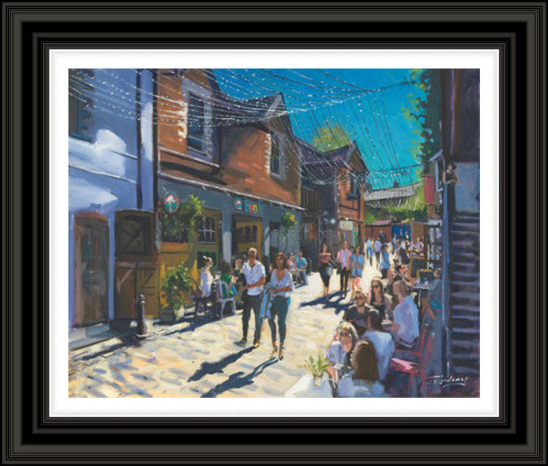Summer on Ashton Lane by James Somerville Lindsay framed wall art print showing Ashton Lane in Glasgow during summer, with the much-loved West End lane given a bright, inviting feel